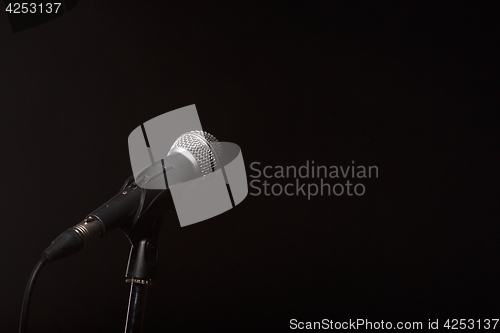 Image of Microphone on empty black background