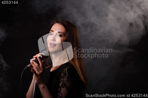 Image of Singing girl background of smoke