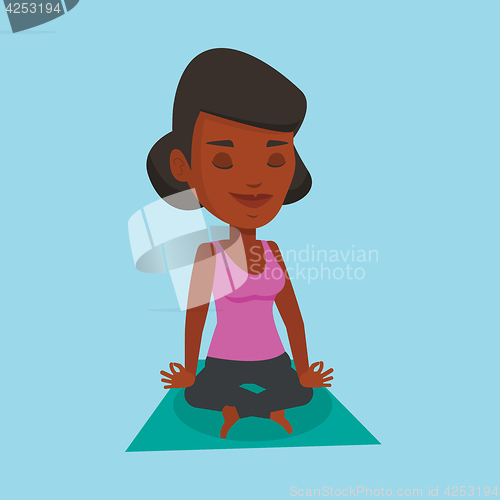 Image of Woman meditating in yoga lotus pose.