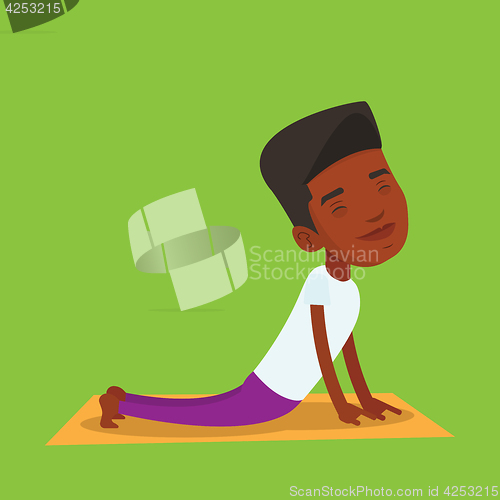 Image of Man practicing yoga upward dog pose.