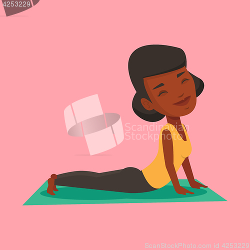 Image of Woman practicing yoga upward dog pose.