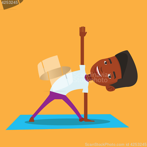 Image of Man practicing yoga triangle pose.