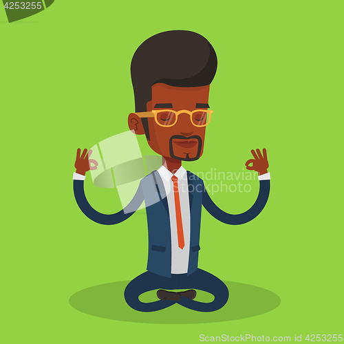 Image of Businessman meditating in lotus position.