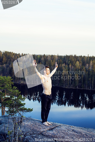 Image of middle age man doing sport yoga on the top of the mountain, lifestyle people outdoor, summer wild nature for training