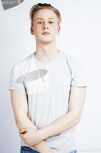 Image of young handsome teenage hipster guy posing emotional, happy smiling against white background isolated, lifestyle people concept