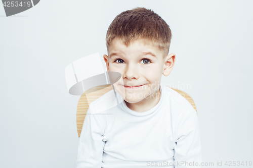 Image of little cute adorable boy posing gesturing cheerful on white background, lifestyle people concept closeup