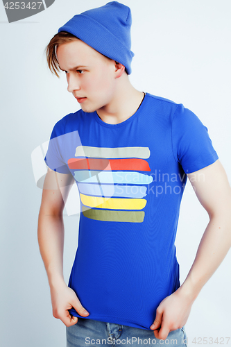 Image of young handsome teenage hipster guy posing emotional, happy smiling against white background isolated, lifestyle people concept
