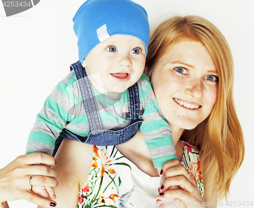 Image of young beauty mother with cute baby, red head happy modern family