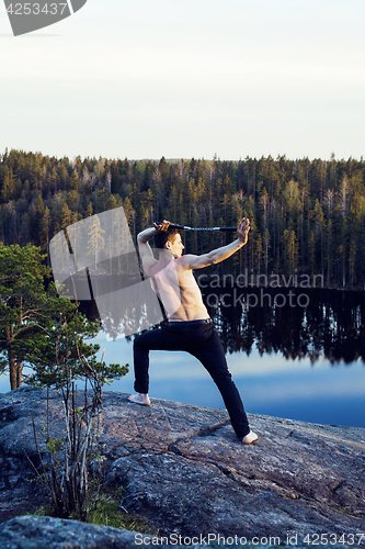 Image of middle age man doing sport yoga on the top of the mountain, lifestyle people outdoor, summer wild nature for training