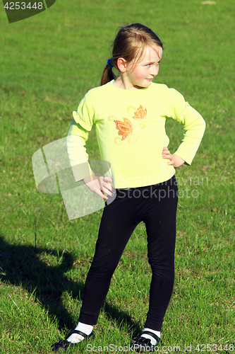 Image of little girl standing at in the business position