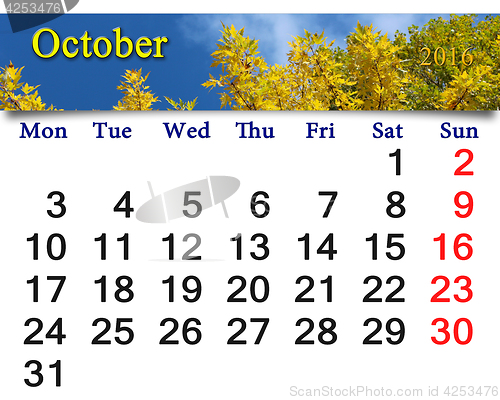 Image of calendar for October 2016 with yellow leaves