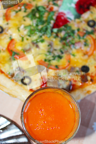 Image of pizza with tomato juice