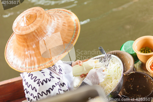 Image of Thai woman preparing food