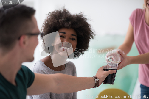 Image of multiethnic group of young people have a lunch break