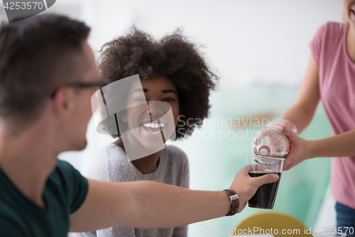 Image of multiethnic group of young people have a lunch break