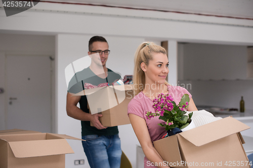 Image of young couple moving into a new home