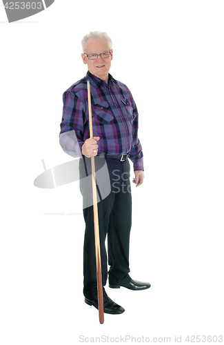 Image of Senior standing with billiard cue.