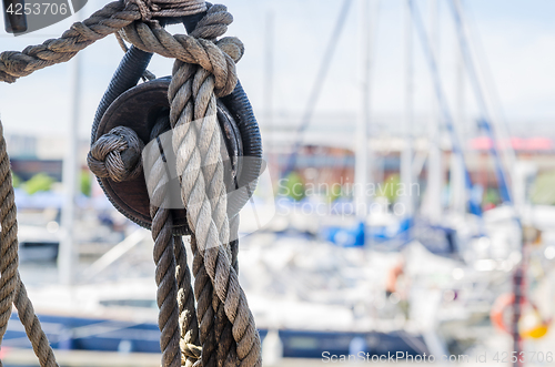 Image of Rigging on the old sailboat against the background of modern yac