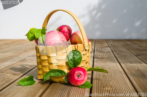 Image of Basket with ripe red apples, close-up