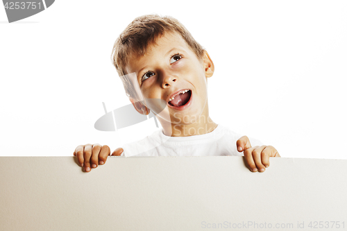 Image of little cute boy holding empty shit to copyspace isolated close u