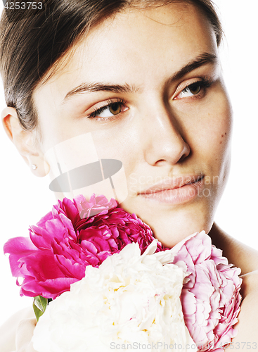 Image of young beauty woman with flower peony pink closeup makeup soft te