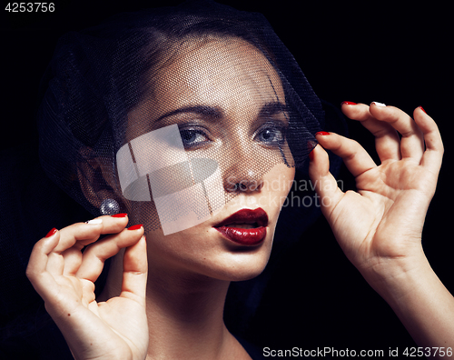 Image of beauty brunette woman under black veil with red manicure close u