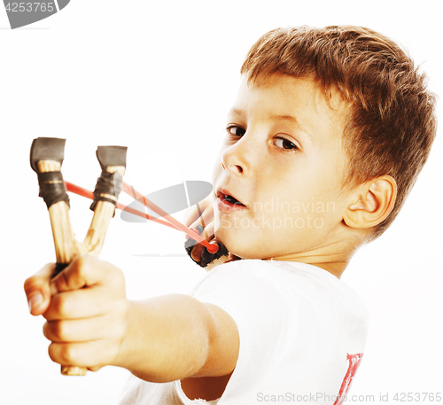 Image of little cute angry real boy with slingshot isolated