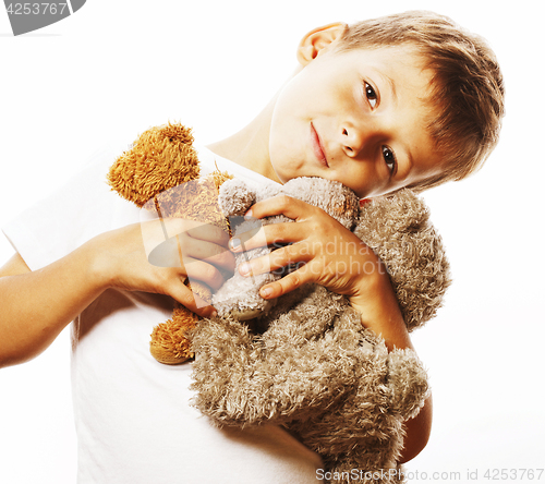 Image of little cute boy with many teddy bears hugging isolated close up