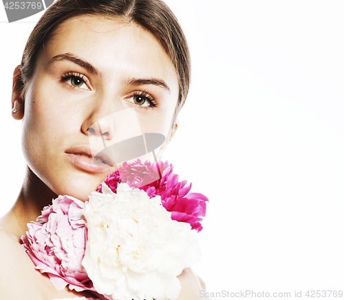 Image of young beauty woman with flower peony pink closeup makeup soft te