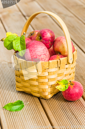 Image of Basket with ripe red apples, close-up