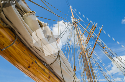Image of Folded sail and mast on an old sailboat