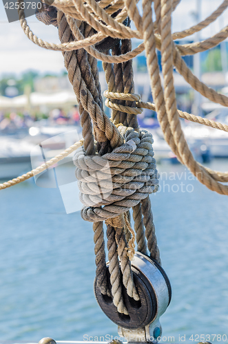 Image of Rigging on the old sailboat against the background of modern yac