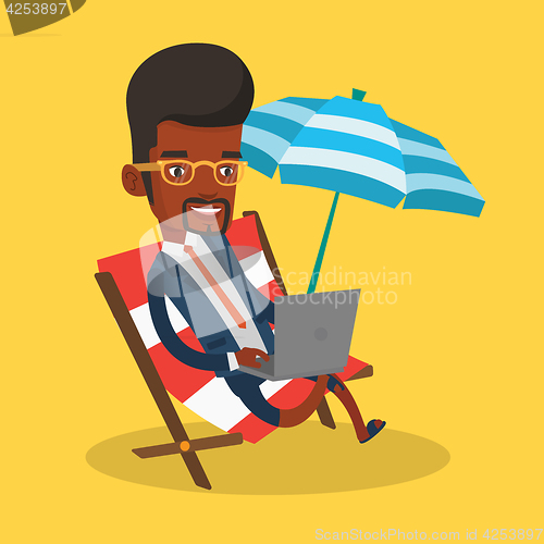 Image of Businessman working on laptop at the beach.