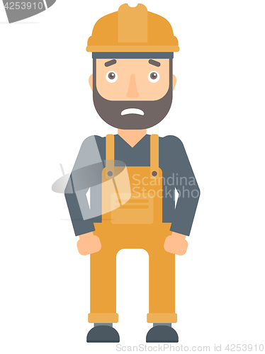 Image of Scared industrial worker in hard hat.