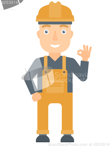 Image of Smiling builder showing ok sign.