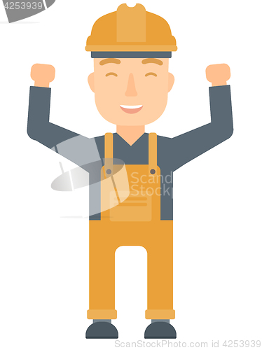 Image of Engineer standing with raised arms up.