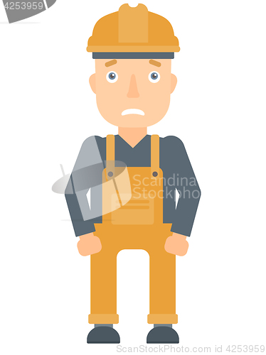 Image of Scared industrial worker in hard hat.