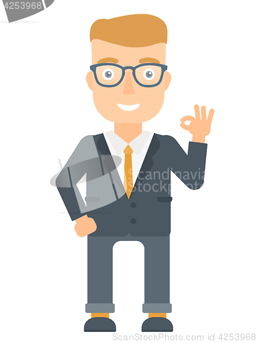 Image of Smiling businessman showing ok sign.