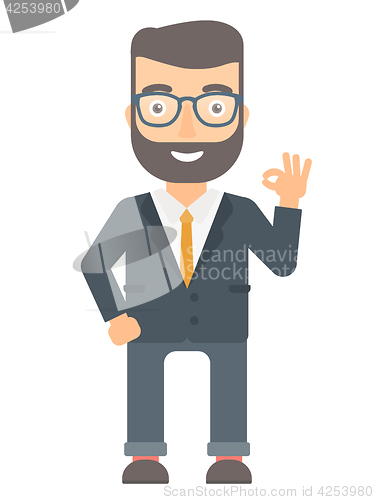 Image of Smiling businessman showing ok sign.