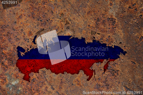 Image of Map and flag of Russia on rusty metal