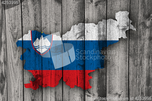 Image of Map and flag of Slovenia on weathered wood