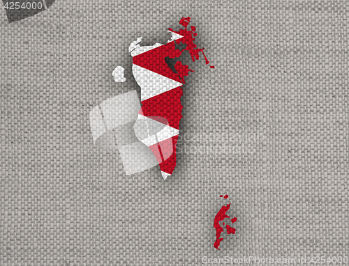 Image of Map and flag of Bahrain on old linen