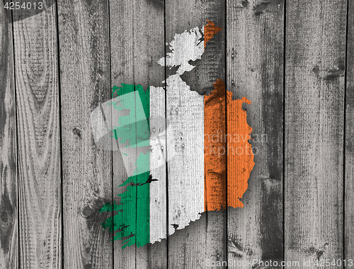 Image of Map and flag of Ireland on weathered wood