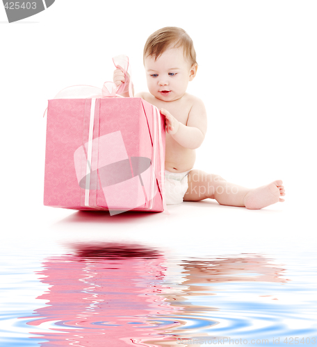 Image of baby boy in diaper with big gift box