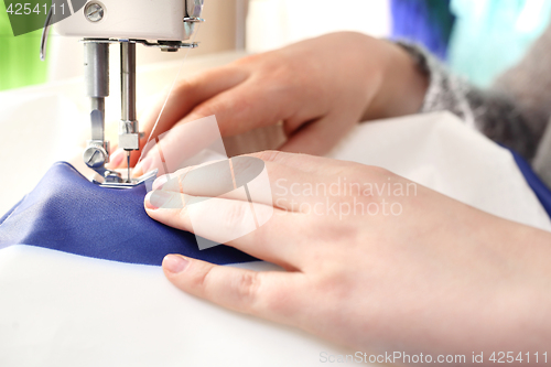 Image of Sewing on a machine.