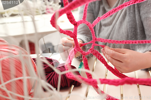 Image of Knitting crochet. The woman knits crochet.