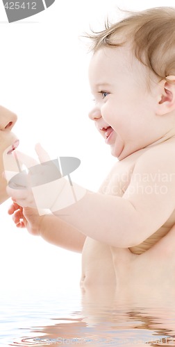 Image of happy cuddle with mother