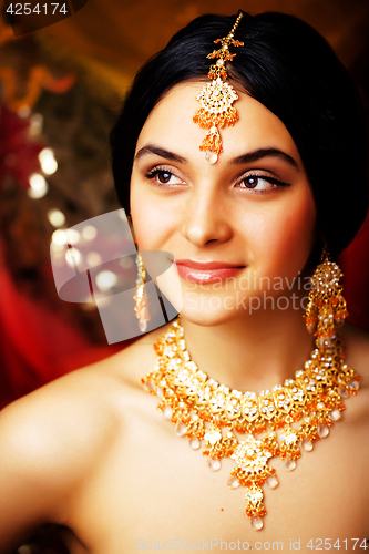 Image of beauty sweet real indian girl in sari smiling on black backgroun