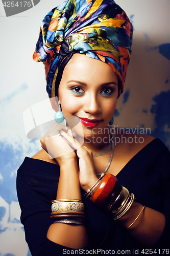 Image of beauty bright african woman with creative make up, shawl on head