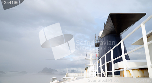 Image of Cruise Ship Sea Ferry Smokestack Cloudy Skies